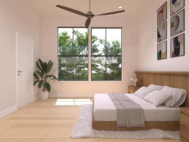 bedroom featuring recessed lighting and wood finished floors