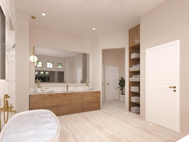 bathroom with vanity and recessed lighting