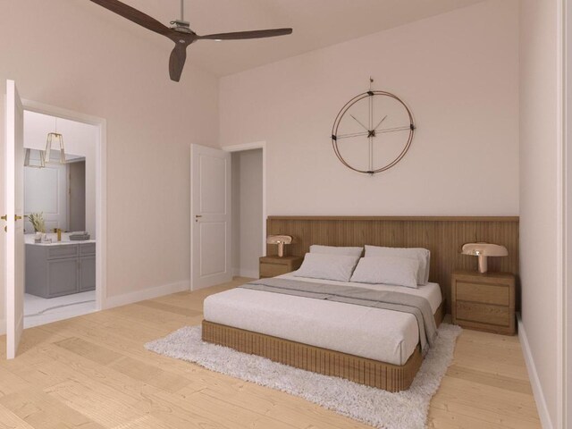 bedroom featuring ensuite bath, light wood-style flooring, and baseboards