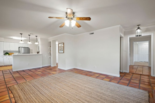 unfurnished living room featuring visible vents, crown molding, baseboards, and light tile patterned floors