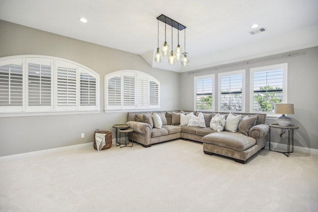 carpeted living room with visible vents, recessed lighting, and baseboards