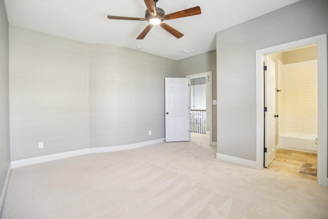 unfurnished bedroom with baseboards, light carpet, and a ceiling fan