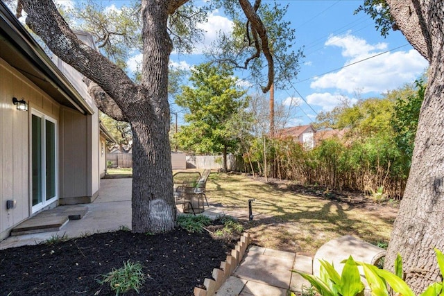 view of yard featuring a patio area and fence