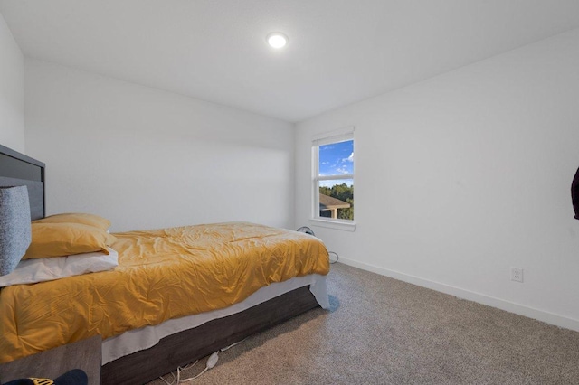 carpeted bedroom with baseboards