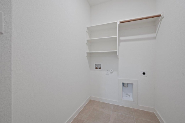 washroom featuring washer hookup, hookup for a gas dryer, electric dryer hookup, laundry area, and baseboards