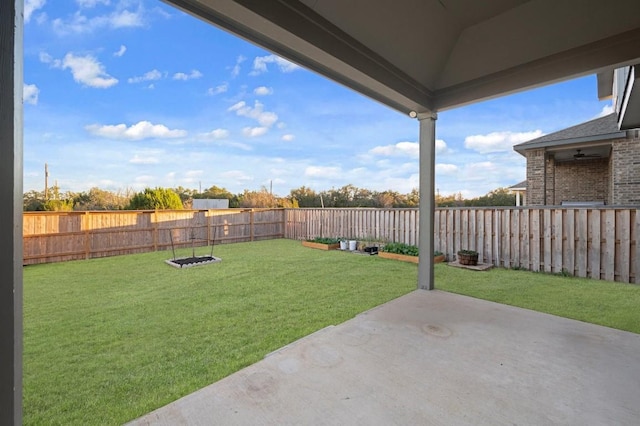 view of yard featuring a patio and a fenced backyard