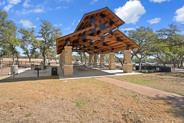 view of property's community with a gazebo and a lawn