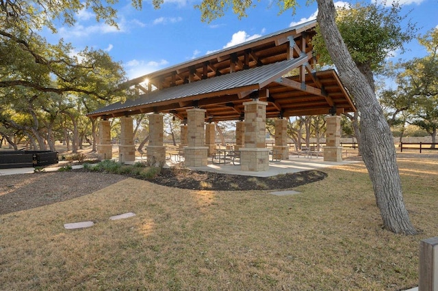 view of home's community with a gazebo and a yard