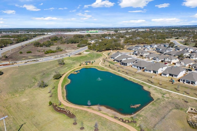 bird's eye view featuring a residential view and a water view