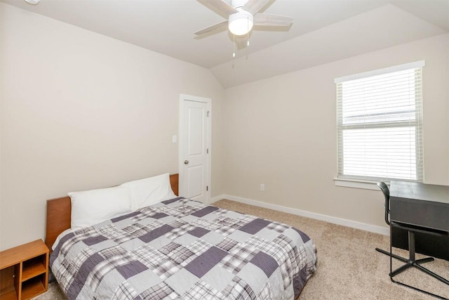 carpeted bedroom with lofted ceiling, ceiling fan, and baseboards