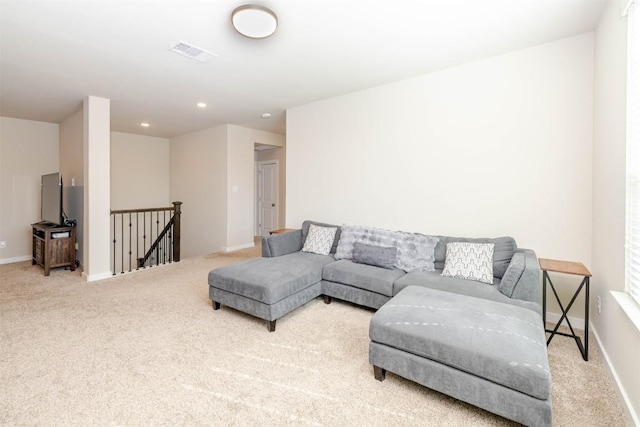 living room with carpet floors, recessed lighting, visible vents, and baseboards