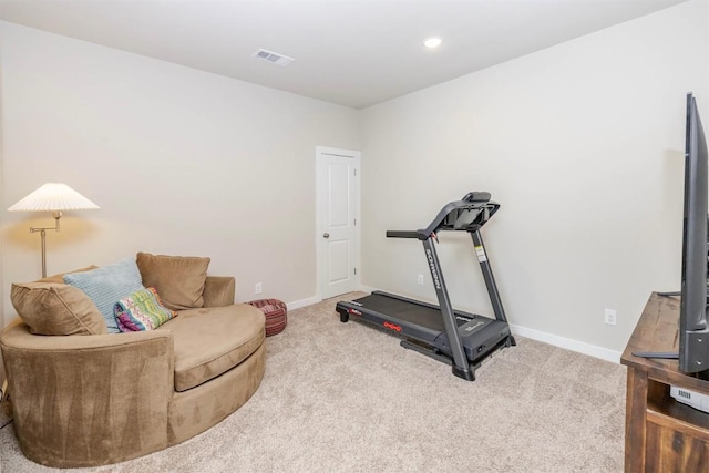 exercise area with carpet flooring, visible vents, and baseboards