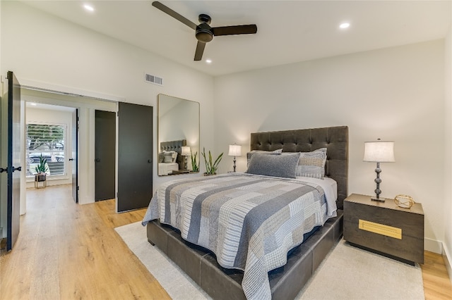 bedroom with a ceiling fan, recessed lighting, visible vents, and light wood-type flooring