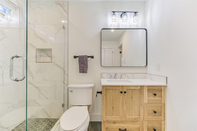 full bath with a shower stall, toilet, and vanity