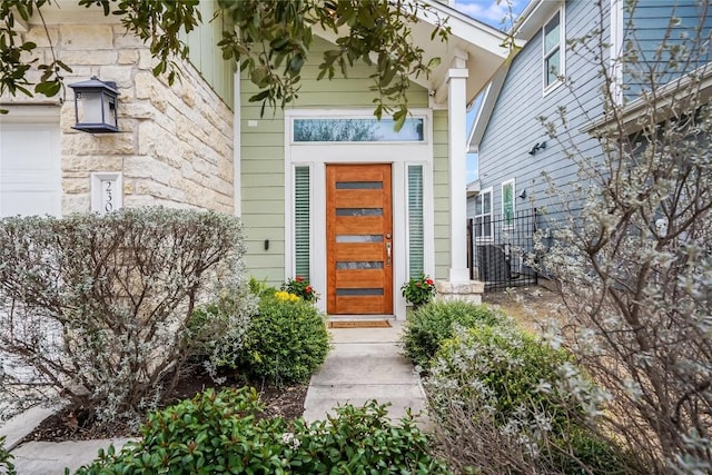 entrance to property featuring a garage