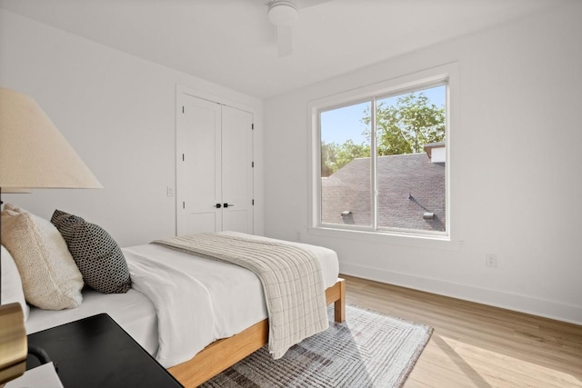 1912 Madison Ave, Austin, TX 78757 - bedroom with wood finished floors, baseboards, a closet, and a ceiling fan