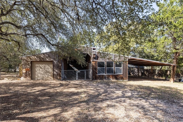 exterior space featuring a carport and driveway