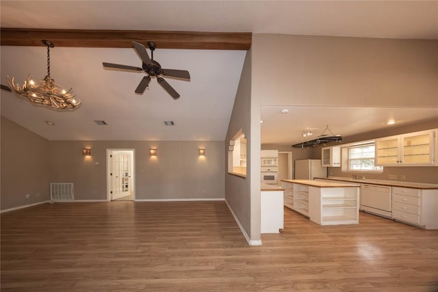 unfurnished living room with light wood-style floors, visible vents, and baseboards