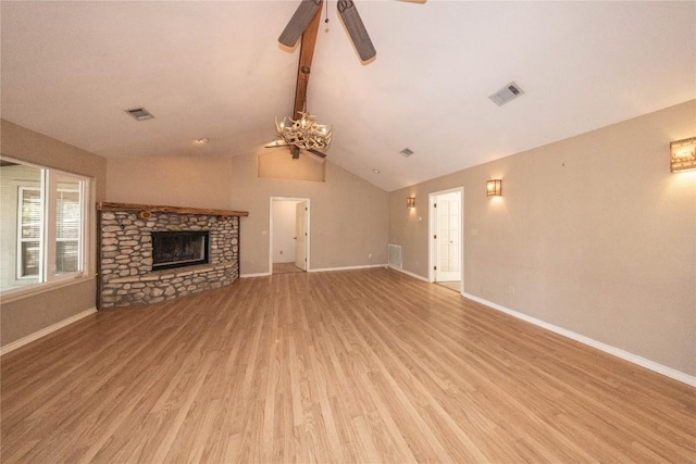 unfurnished living room featuring light wood finished floors, baseboards, a fireplace, and visible vents