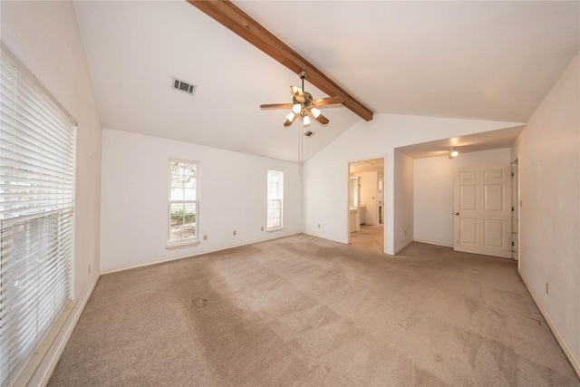 unfurnished bedroom with visible vents, lofted ceiling with beams, a ceiling fan, light carpet, and baseboards