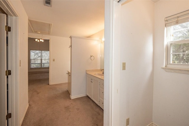 bathroom with a wealth of natural light, vanity, visible vents, and baseboards