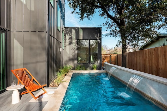 view of swimming pool featuring a fenced backyard and a fenced in pool