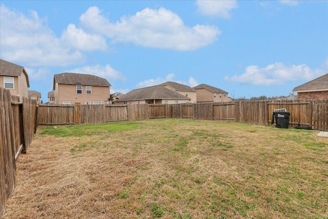 view of yard with a fenced backyard