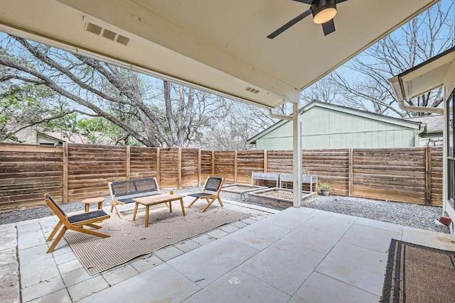 view of patio / terrace with a ceiling fan, visible vents, and a fenced backyard