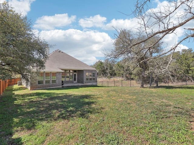 view of yard featuring a patio area and a fenced backyard