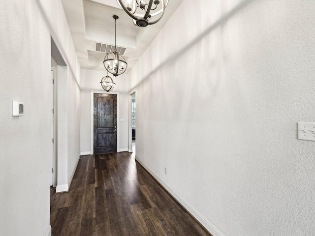 141 Bear Paw Run, Georgetown, TX 78628 - entrance foyer with a chandelier, wood finished floors, and baseboards