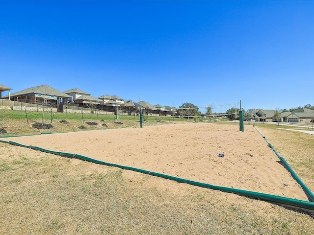 141 Bear Paw Run, Georgetown, TX 78628 - view of property's community with volleyball court, fence, and a residential view