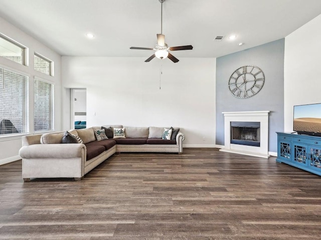 141 Bear Paw Run, Georgetown, TX 78628 - living area featuring ceiling fan, a fireplace with raised hearth, wood finished floors, baseboards, and recessed lighting