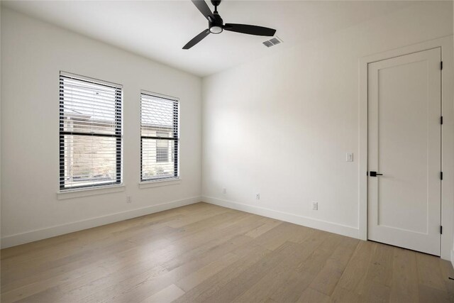 116 Azalea Loop, Horseshoe Bay, TX 78657 - spare room with light wood-type flooring, ceiling fan, and baseboards