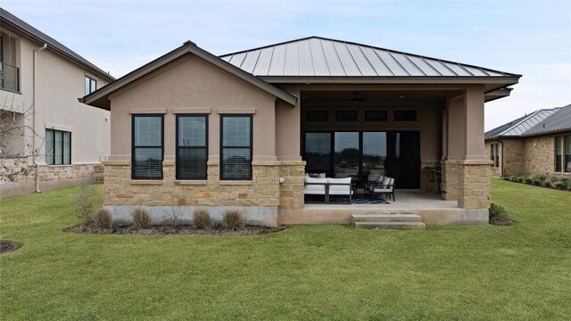 116 Azalea Loop, Horseshoe Bay, TX 78657 - rear view of house featuring stone siding, stucco siding, and a lawn