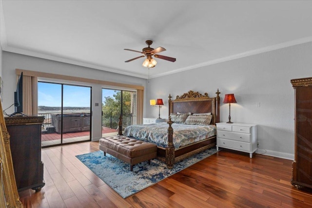 bedroom with access to outside, wood finished floors, and crown molding