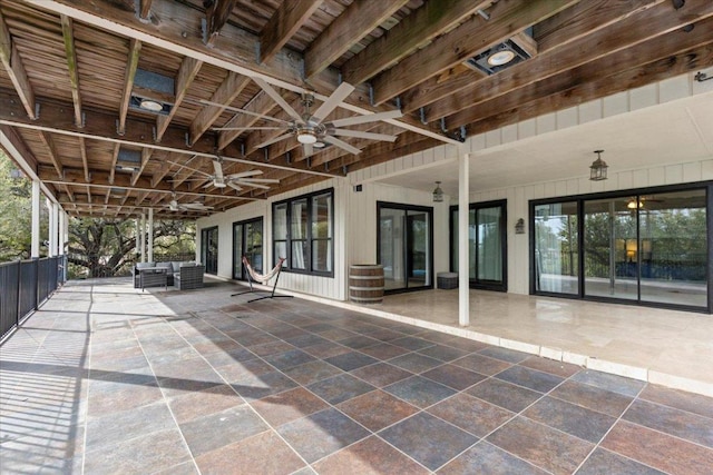 view of patio / terrace with ceiling fan and an outdoor living space