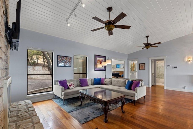 living room featuring wooden ceiling, baseboards, vaulted ceiling, wood-type flooring, and rail lighting