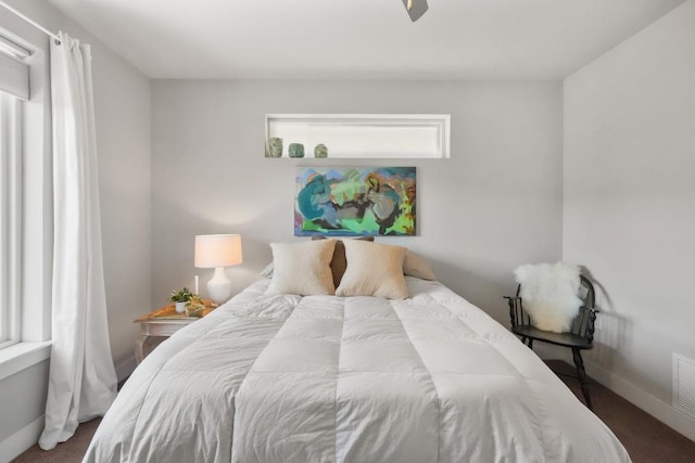 bedroom with visible vents and baseboards