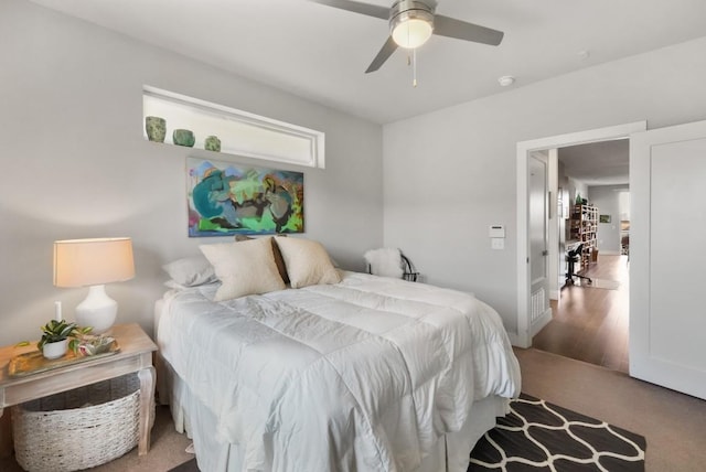 carpeted bedroom featuring a ceiling fan