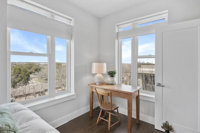 office space featuring dark wood-style flooring and baseboards