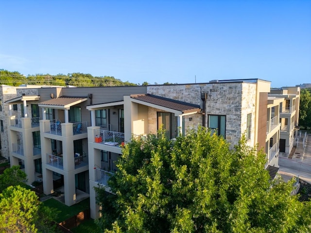 2801 Dulce Ln Unit 731, Austin, TX 78704 - rear view of property with stone siding and stucco siding