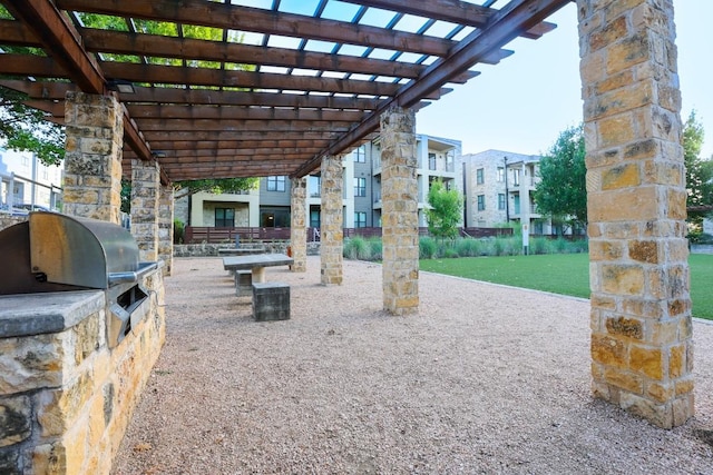 2801 Dulce Ln Unit 731, Austin, TX 78704 - view of patio with an outdoor kitchen and a pergola