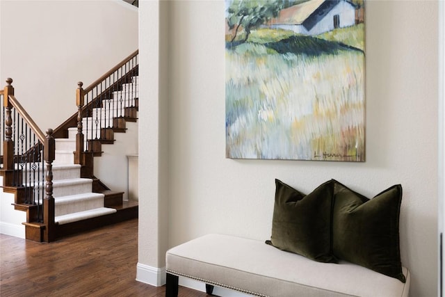 interior space with baseboards and wood finished floors