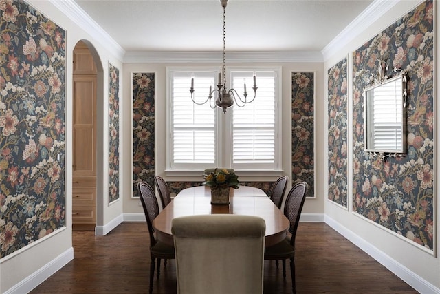 dining space with arched walkways, a notable chandelier, dark wood finished floors, and baseboards