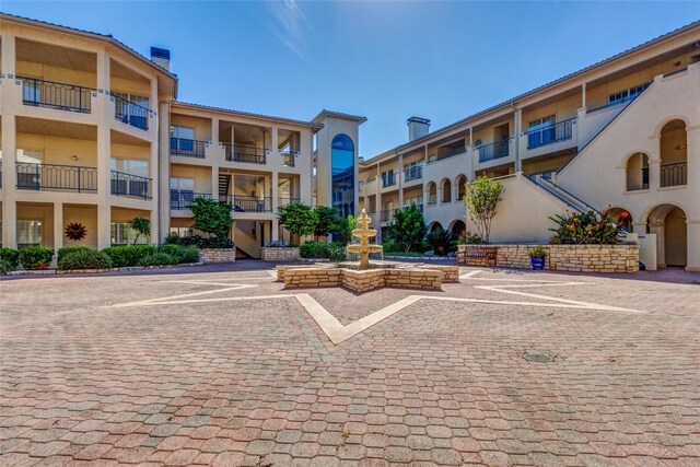 view of property's community with uncovered parking