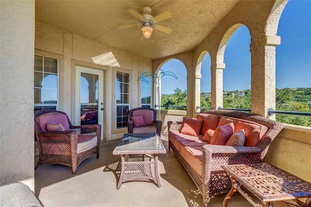 exterior space featuring ceiling fan and an outdoor hangout area