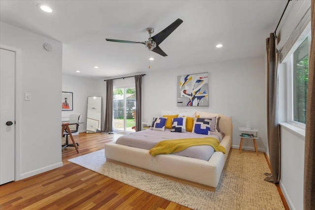 bedroom with baseboards, ceiling fan, wood finished floors, and recessed lighting