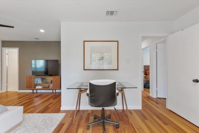 office featuring recessed lighting, wood finished floors, visible vents, and baseboards