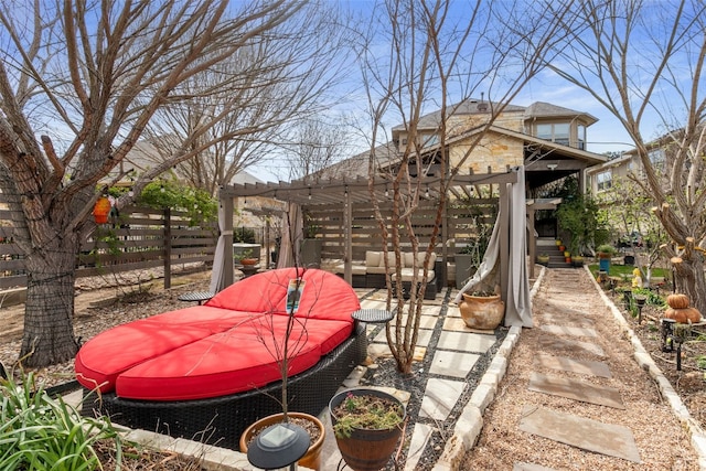 view of yard with outdoor lounge area and fence