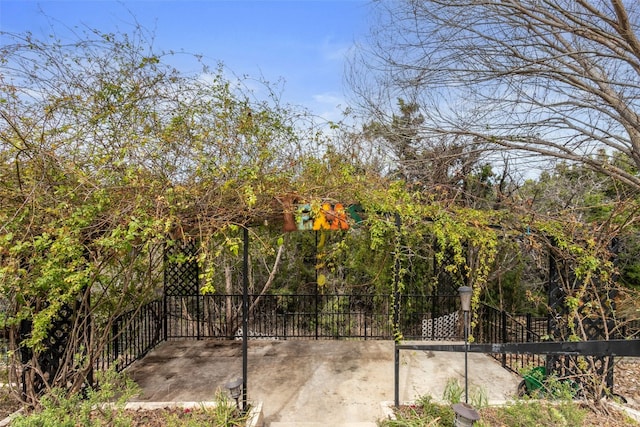 view of gate with fence